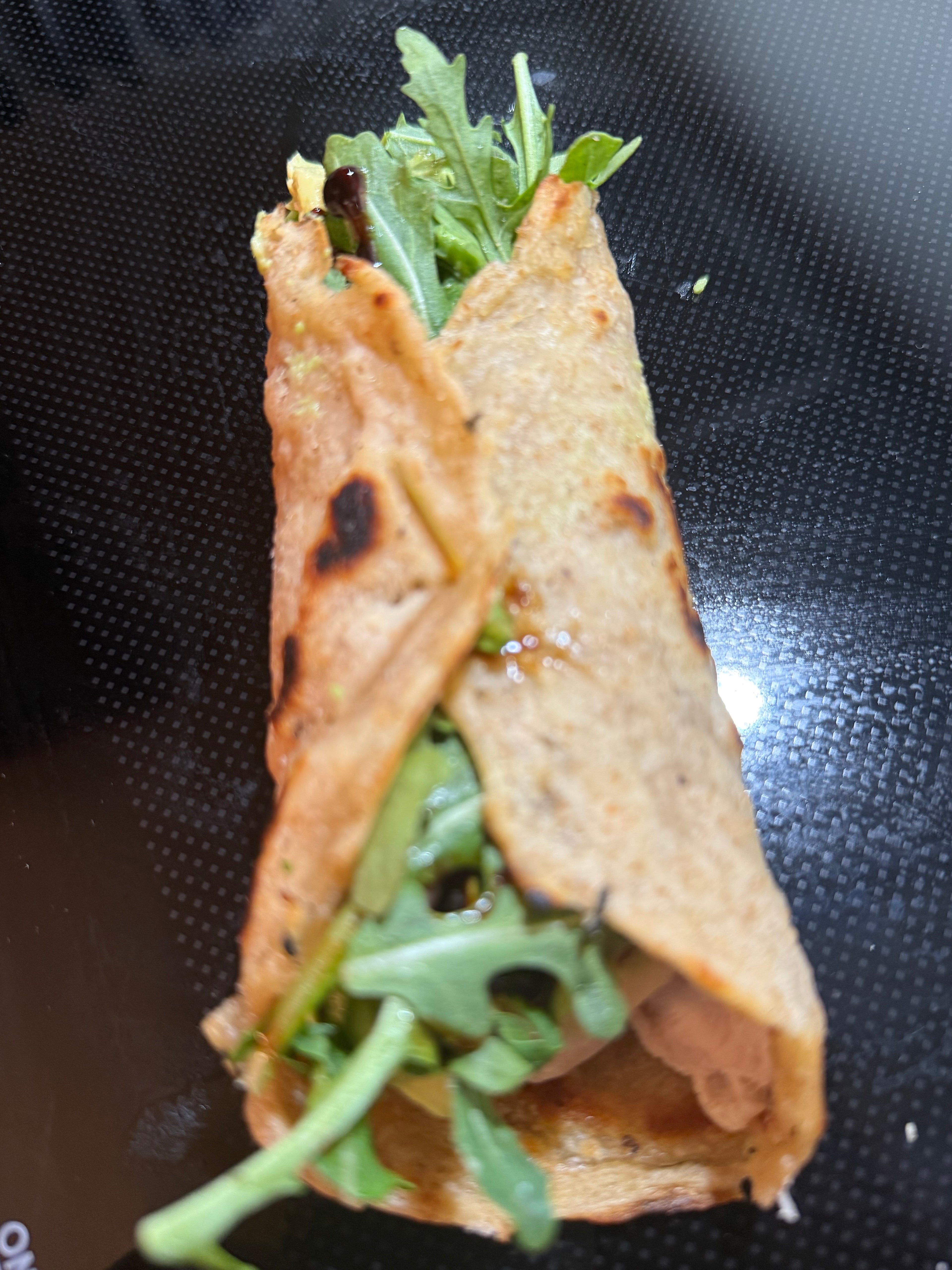 High-protein sourdough wrap with grilled chicken, avocado and arugula